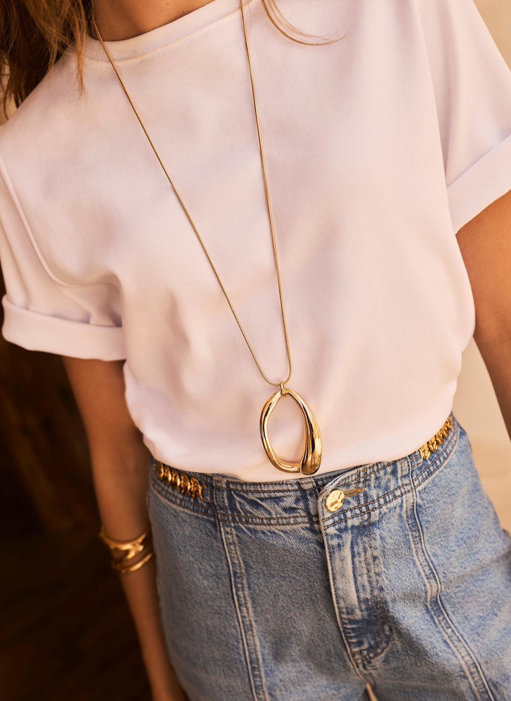 Gold Tone Sculpted Long Pendant
