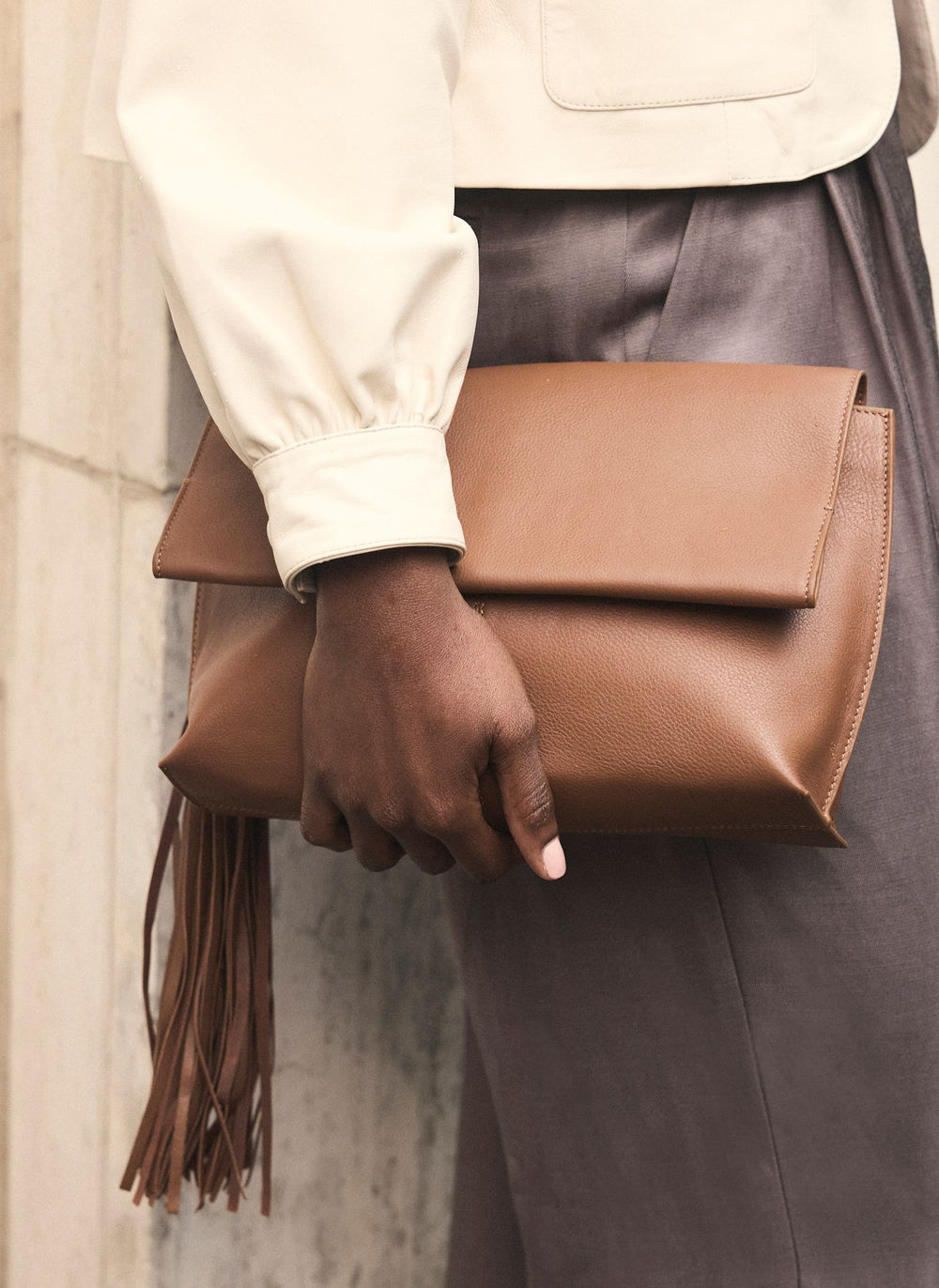 Daisy Tan Leather Fold Over Tassel Clutch