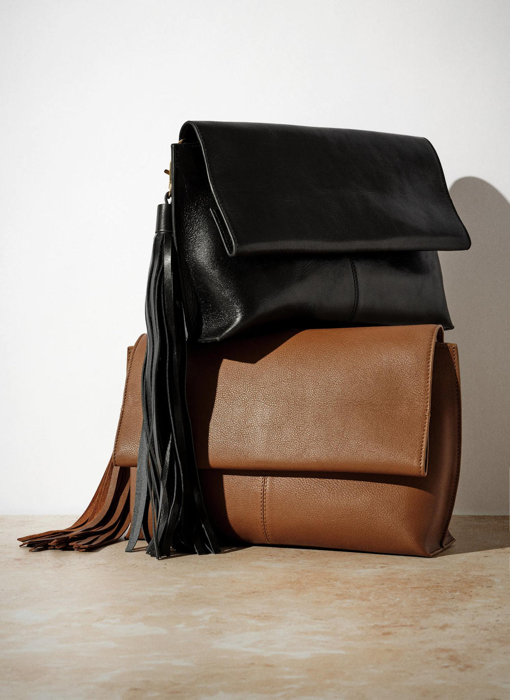 Daisy Tan Leather Fold Over Tassel Clutch