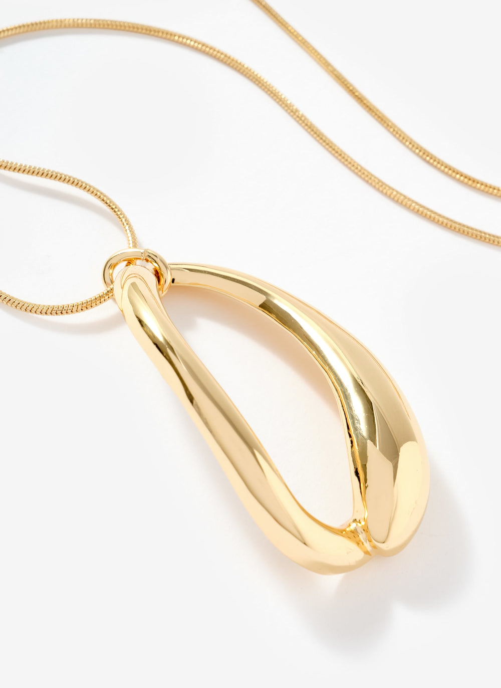 Gold Tone Sculpted Long Pendant